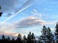 Blue Skies, Chemtrails and Clouds from a Hilltop in the Northwest Royalty Free Stock Photo