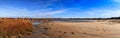 Blue skies over Corporation Beach in Dennis, Massachusetts on Cape Cod Royalty Free Stock Photo