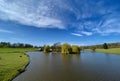 Blue skies over open water at Kedleston Hall, Derbyshire, UK.