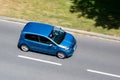 Blue Skoda Citigo car with motion blur effect in top view