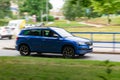 Blue Skoda Karoq crossover with strong motion blur effect