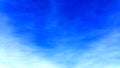 The blue sky abstract shot with plane and blending clouds. Royalty Free Stock Photo