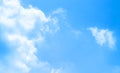 Blue sky against white floating clouds background