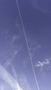 Blue sky and airplane, vapor trail Royalty Free Stock Photo