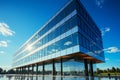 Blue-sky backdrop complements a sleek modern office building, representing corporate sophistication. Royalty Free Stock Photo