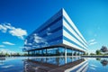 Blue-sky backdrop complements a sleek modern office building, representing corporate sophistication. Royalty Free Stock Photo