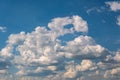 Blue sky background with big white tiny stratus cirrus striped clouds Royalty Free Stock Photo