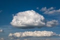 Blue sky background with big white tiny stratus cirrus striped clouds Royalty Free Stock Photo