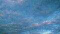 Blue sky background with cirrocumulus clouds. Sunlight and sun ray at sunshine on sunset. Royalty Free Stock Photo