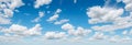 blue sky background with clouds. wide web banner. Blue sky and white clouds floated in the sky on a clear day with warm sunshine Royalty Free Stock Photo