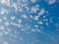 Blue sky background with cumulus white clouds, nature photography, sun rays, natural background, cloud wallpaper Royalty Free Stock Photo