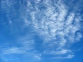 Blue sky background with fleecy clouds