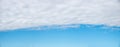 Blue sky background with light grey cloud overcast in the upper half Royalty Free Stock Photo