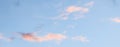 Blue sky background with pale pink clouds at sunset Royalty Free Stock Photo