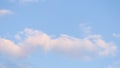 Blue sky background with pale pink clouds at sunset Royalty Free Stock Photo