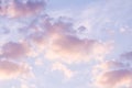 Blue sky background with pale pink clouds at sunset Royalty Free Stock Photo