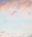 Blue sky background with pale pink clouds at sunset Royalty Free Stock Photo