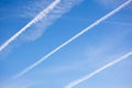 Blue sky background and plane traces.