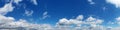 Blue Sky background with tiny Clouds. Panorama Royalty Free Stock Photo