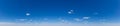 Blue Sky background with tiny Clouds. Panorama Royalty Free Stock Photo