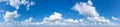Blue Sky background with tiny Clouds. Panorama Royalty Free Stock Photo