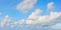 BLUE SKY BACKGROUND WITH WHITE CLOUDS IN SPRINGTIME IN A SUNNY DAY Royalty Free Stock Photo