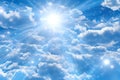 Blue sky background with white clouds and sun rays Royalty Free Stock Photo