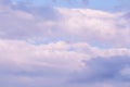 Blue sky background with white and pink clouds at sunset Royalty Free Stock Photo