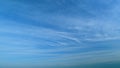 Blue sky with beautiful cirrostratus clouds. Beautiful sunny blue sky background with cirrus clouds. Timelapse. Royalty Free Stock Photo