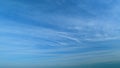 Blue sky with beautiful cirrostratus clouds. Beautiful sunny blue sky background with cirrus clouds. Timelapse. Royalty Free Stock Photo