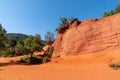 Blue sky beautiful red ochres luberon hills and green pines in Roussillon France Royalty Free Stock Photo