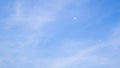 A blue sky with beautiful wisp of cloud for use as a backing or backdrop Royalty Free Stock Photo