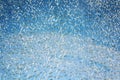 Blue sky behind broken glass surface. Aged photo. Royalty Free Stock Photo