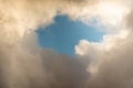 Blue sky behind dark storm clouds background texture, thunderstorm Royalty Free Stock Photo