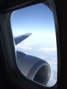 Blue sky behind plane window