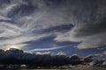Blue sky behind stormy clouds. Royalty Free Stock Photo