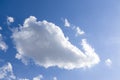 Blue sky with a big white cloud in sunshine Royalty Free Stock Photo