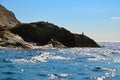 Blue sky, birds, sea waves, rocky shore on the Black sea in Crimea. Royalty Free Stock Photo