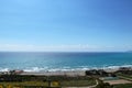Blue sky and blu sea with average waves on coast. View on Kourion beach at very sharp sun. Huge beach in South Cyprus, Ideal for