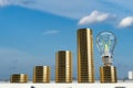 Blue sky capital city urban coin golden lightbulb lamp fluorescent power electrical glass technology digital wealth rich money