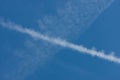 Blue sky with chemtrails or contrails Royalty Free Stock Photo