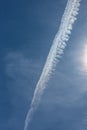 Blue sky with chemtrails or contrails Royalty Free Stock Photo