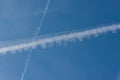 Blue sky with chemtrails or contrails Royalty Free Stock Photo