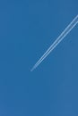 Blue sky with chemtrails or contrails Royalty Free Stock Photo