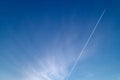 Blue sky, Cirrus clouds, among which the trace of the plane Royalty Free Stock Photo