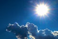 Blue sky and cloud with bright sun star flare background Royalty Free Stock Photo