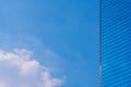 Blue sky with cloud and modern blue office building. Royalty Free Stock Photo