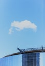 A cloud on a modern skyscraper Royalty Free Stock Photo