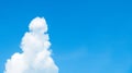 Blue Sky with Cloud in the Snowman Like Shape at The Corner with Copy Space used as Template Royalty Free Stock Photo