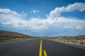 Blue sky and clouds above desert highway Royalty Free Stock Photo